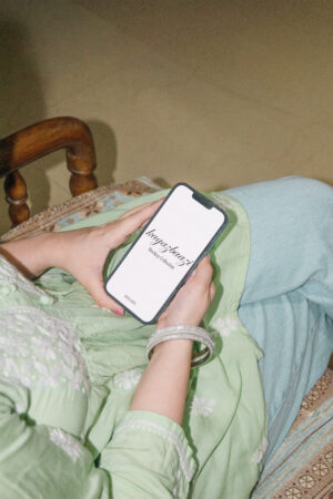 Holding phone on sofa