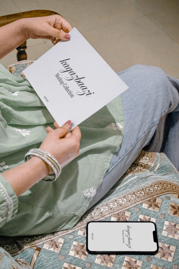holding-paper-with-iphone-on-sofa-2